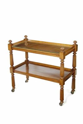 Appraisal: A Victorian mahogany two tier buffet on reeded supports and