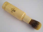 Appraisal: An ivory cased shaving brush approx cm closed