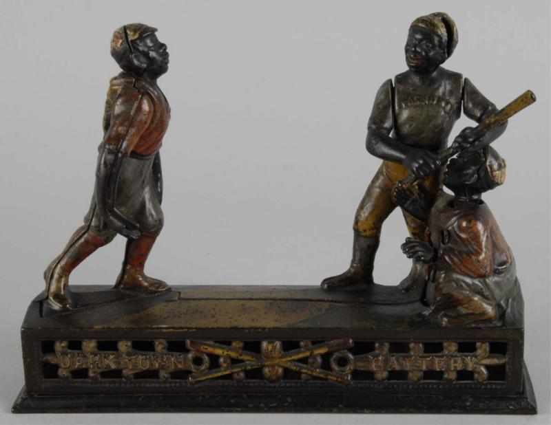 Appraisal: Cast Iron Darktown Battery Mechanical Bank Description Working Manufactured by