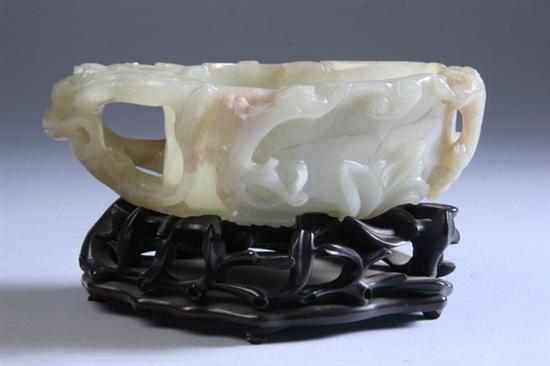 Appraisal: CHINESE CARVED JADE VESSEL Trailing vine decoration with conforming carved