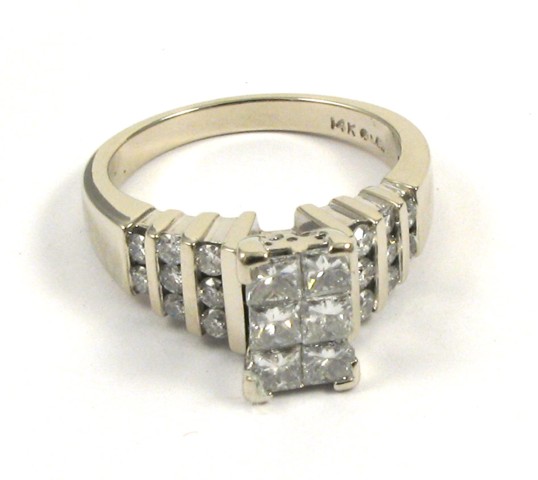 Appraisal: DIAMOND AND FOURTEEN KARAT GOLD RING The white gold band