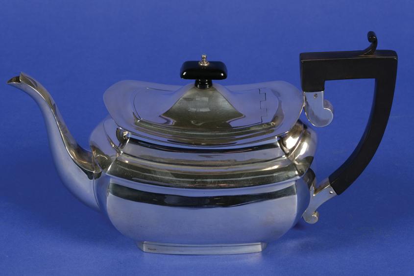 Appraisal: A GEORGE V TEAPOT of shaped rectangular form with a