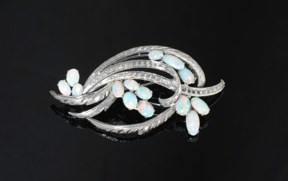 Appraisal: K OPAL BROOCH K white gold brooch contains fourteen oval