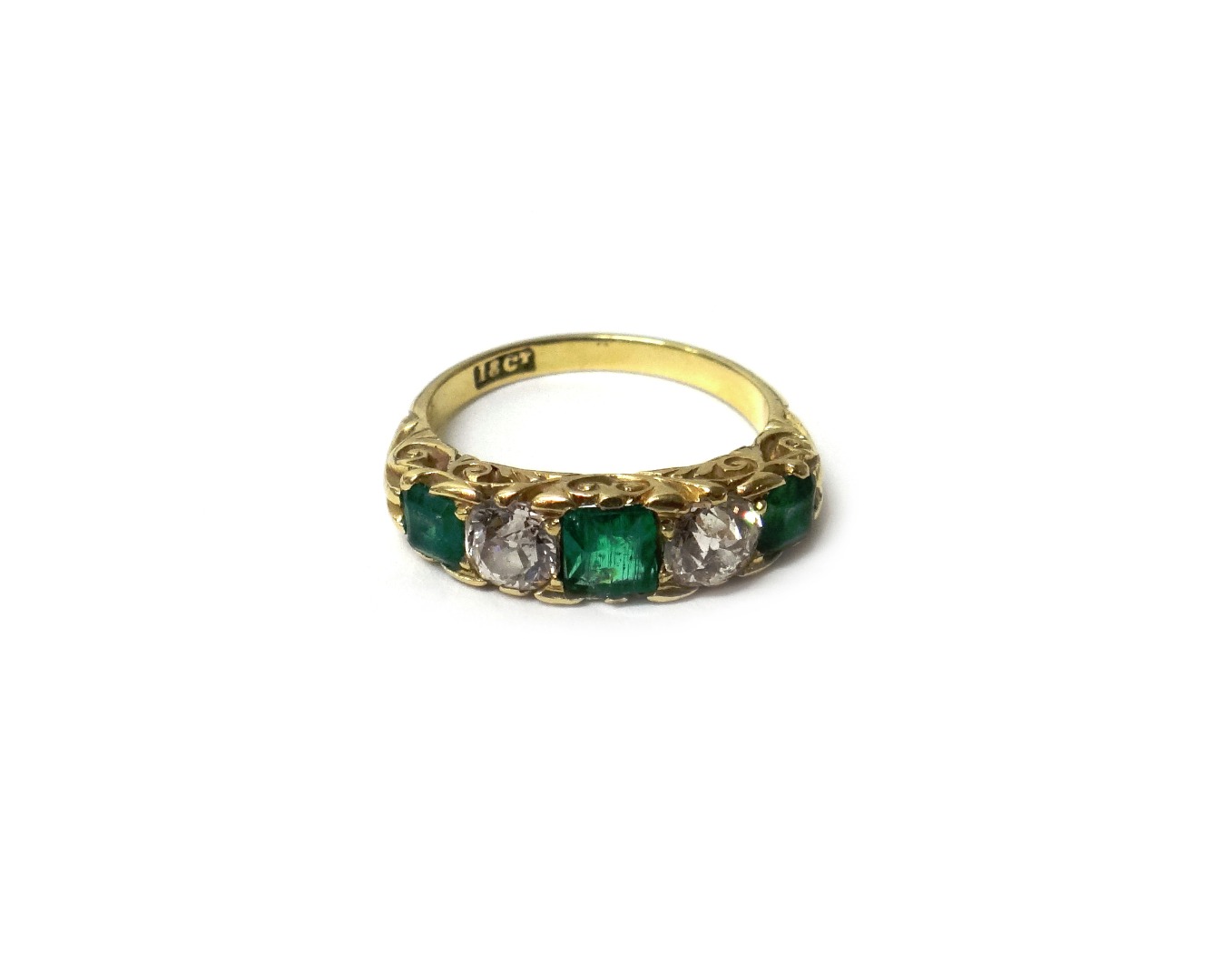 Appraisal: A gold emerald and diamond five stone ring mounted with