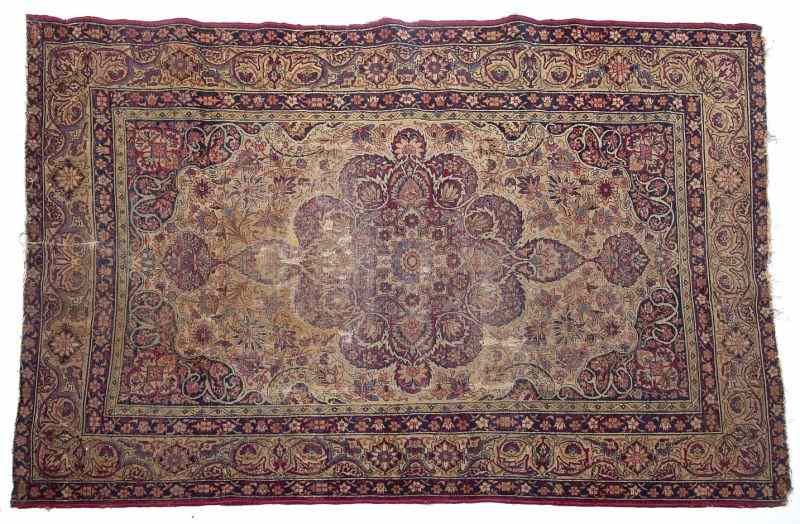 Appraisal: Kirman Oriental Rugivory field red medallion shaped blue corner spandrels