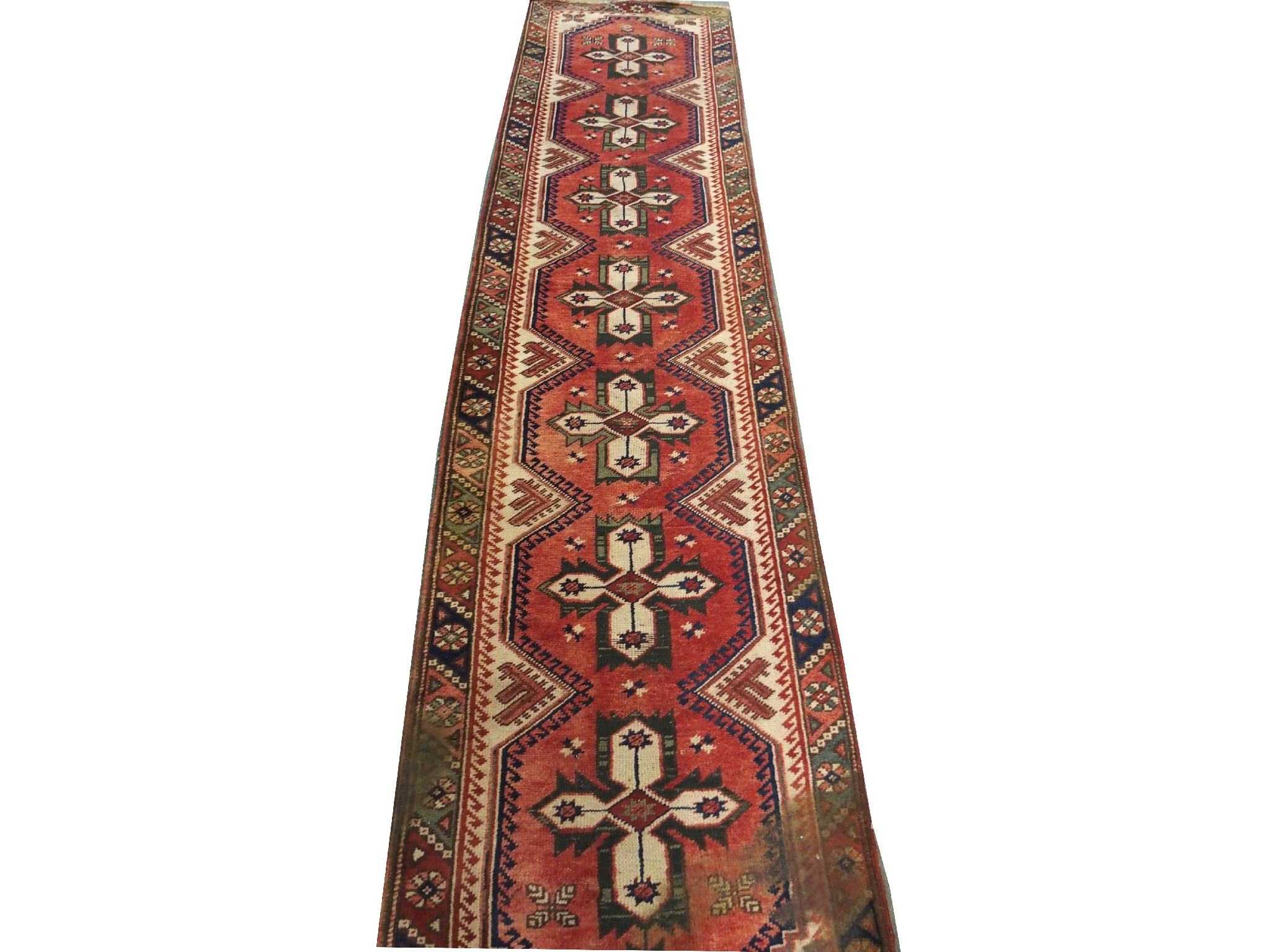 Appraisal: A Persian runnerwith elongated geometric panels x cm another runner