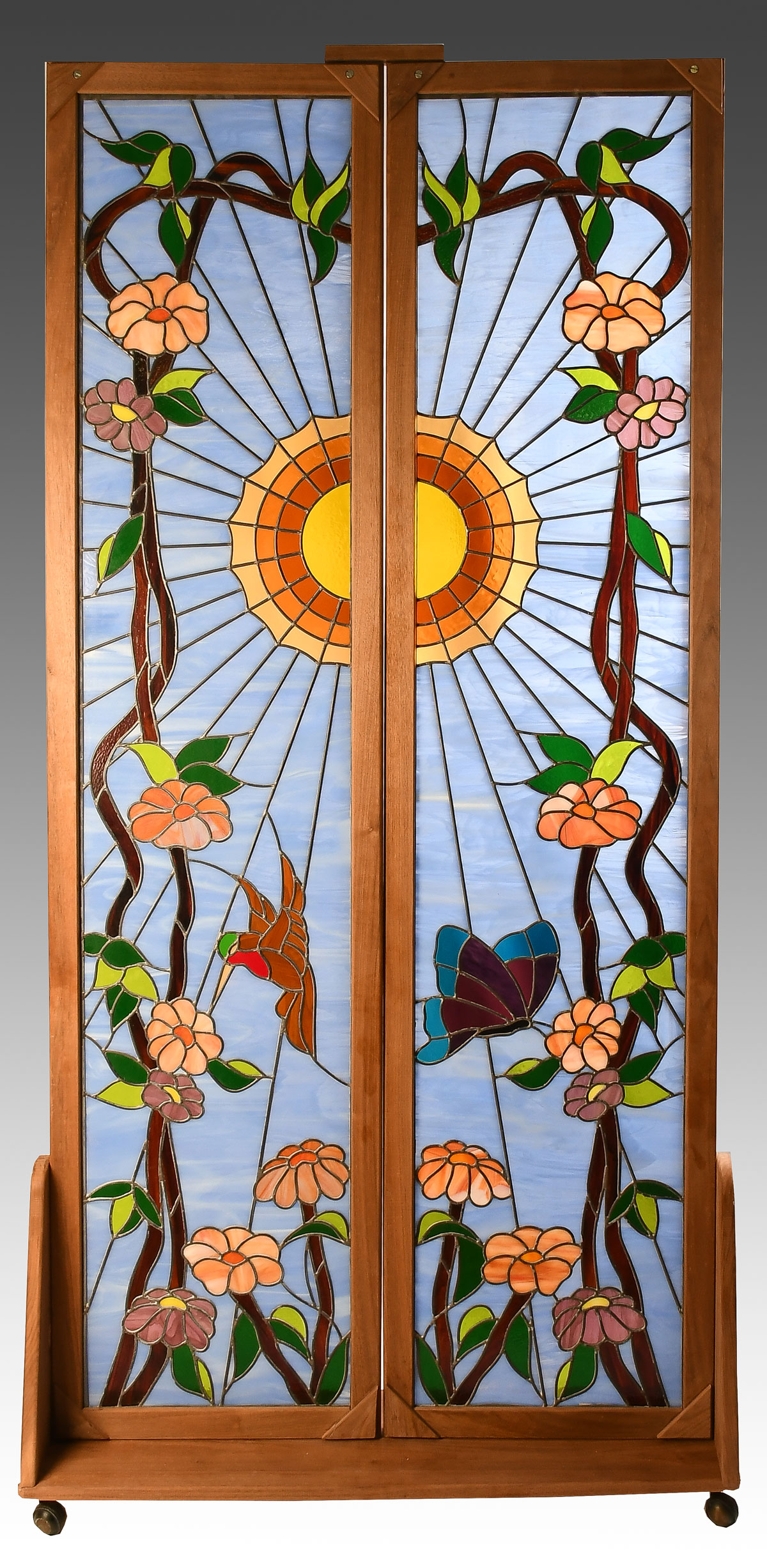 Appraisal: PAIR OF FRAMED LEADED GLASS WINDOWS Having a vibrant Hummingbird