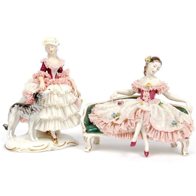 Appraisal: Pair of Dresden lace porcelain figures including lady with dog