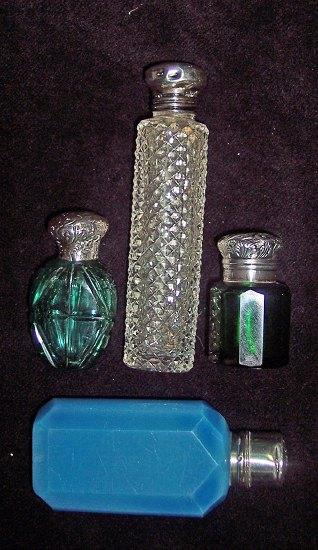 Appraisal: A green glass scent bottle with embossed hinged lid enclosing