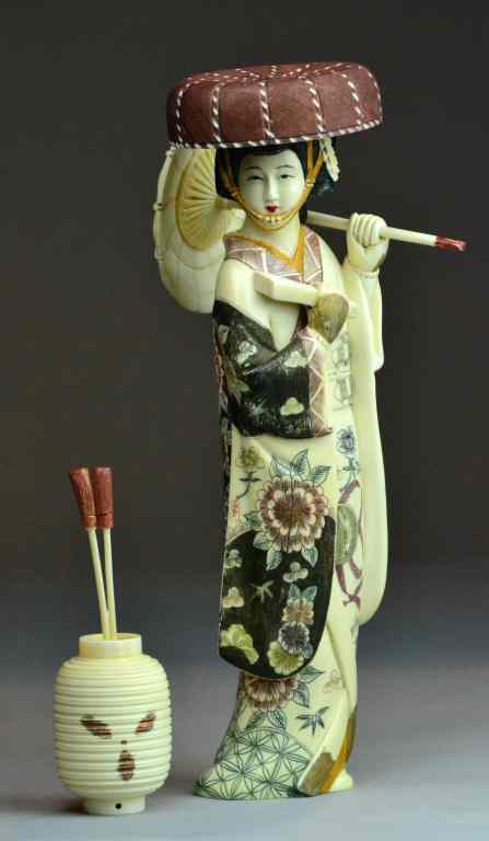 Appraisal: Japanese Polychromed Painted Ivory OkimonoDelicately polychromed lacquered early th century