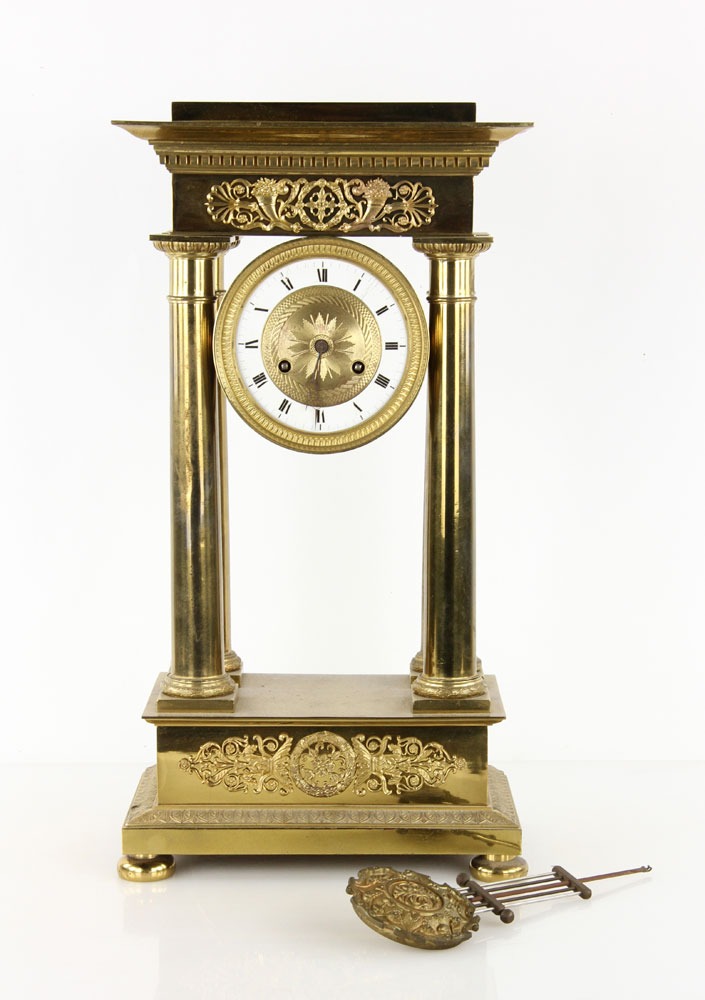 Appraisal: - French Empire Clock Bronze French Empire Style polished bronze