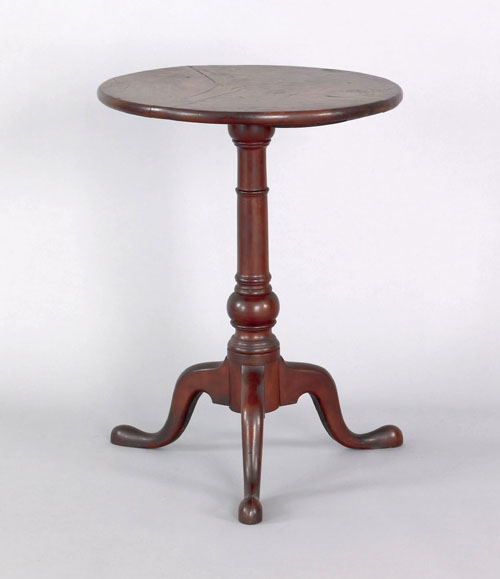 Appraisal: Pennsylvania walnut candlestand ca the circular top above a suppressed