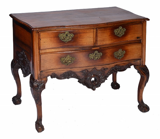 Appraisal: AN TH CENTURY PORTUGESE ROSEWOOD COMMODE of serpentine outline fitted