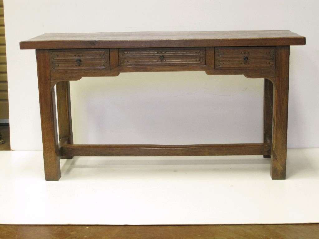 Appraisal: A reproduction Altar type Serving Table with three linenfold carved