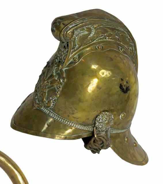 Appraisal: A fireman's brass helmet complete with badge