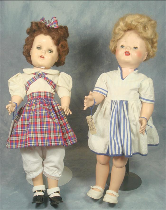 Appraisal: Two Hard Plastic Doll The one in the blue and