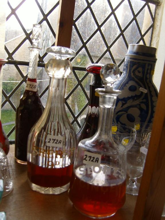 Appraisal: Three th century cut glass decanters engraved sherry d per