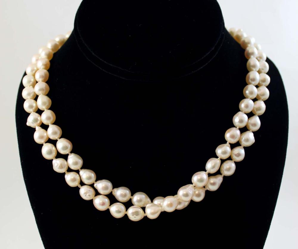 Appraisal: ROPE LENGTH BAROQUE PEARL NECKLACE The hand-knotted strand with well