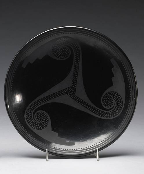 Appraisal: A San Ildefonso blackware plate Marie with a three-arm pinwheel