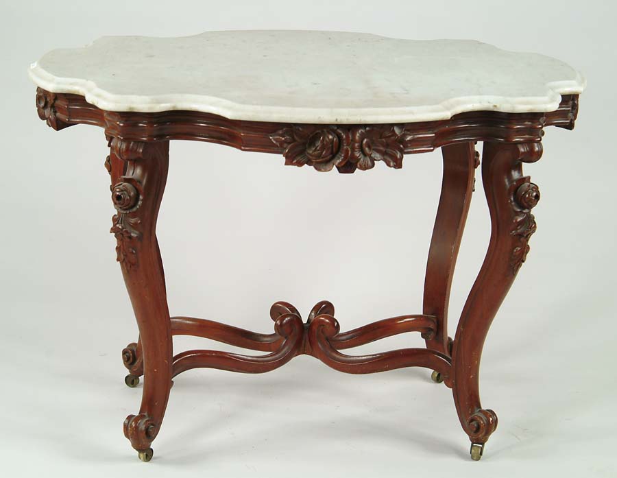 Appraisal: GOOD VICTORIAN CARVED WALNUT TURTLE TOP MARBLE TOP CENTER TABLE