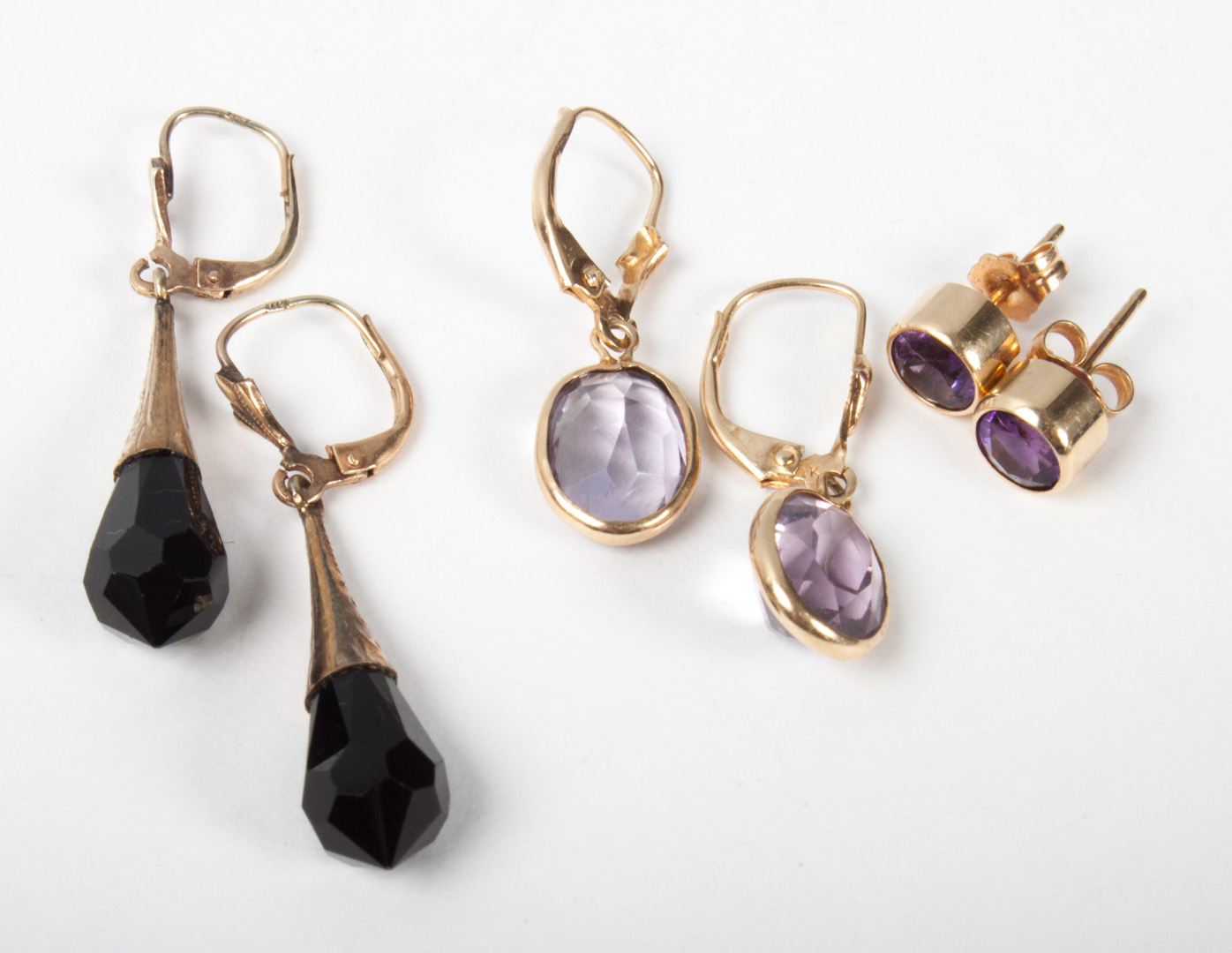 Appraisal: Three pairs of gold and amethyst garnet earrings gold and