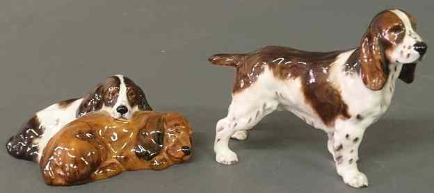 Appraisal: Two Royal Doulton dog figures standing spaniel h