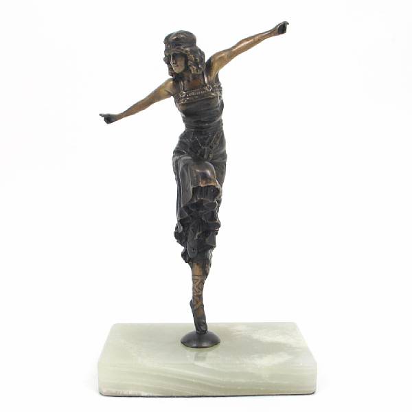 Appraisal: An Art Nouveau patinated figure of a dancer on an