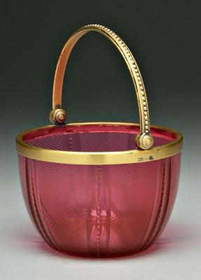 Appraisal: Glass basket with mounts swirled cranberry glass with polished base