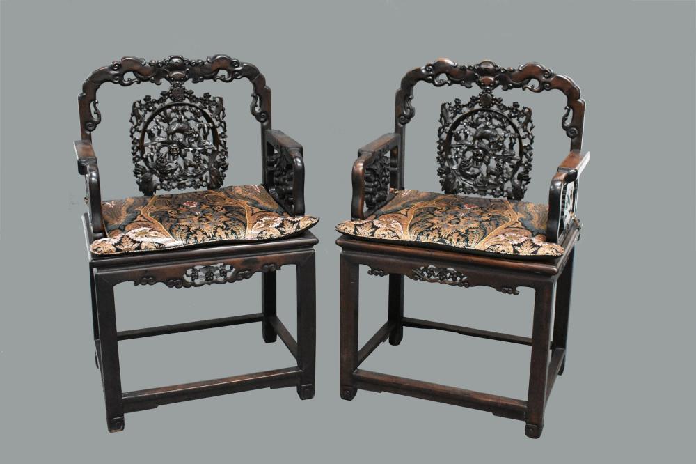 Appraisal: PAIR OF CHINESE CARVED HARDWOOD ARMCHAIRSEarly th Century Each heavily