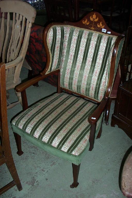 Appraisal: An Edwardian mahogany elbow chair with upholstered seat and winged