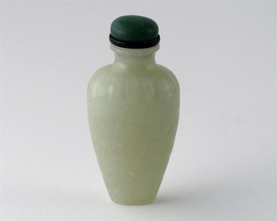 Appraisal: A Chinese jade snuff bottle of tapering baluster form carved