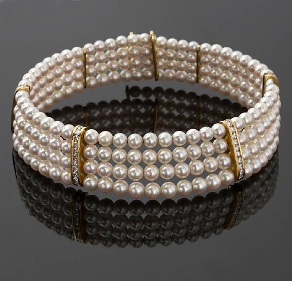 Appraisal: A cultured pearl and diamond flexible collar Lagos pearls measuring