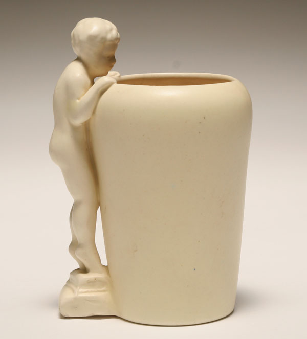 Appraisal: Haeger matte ivory art pottery figural vase with a boy