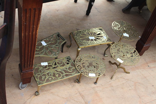 Appraisal: A GROUP OF SIX VARIOUS PIERCED BRASS TRIVETS