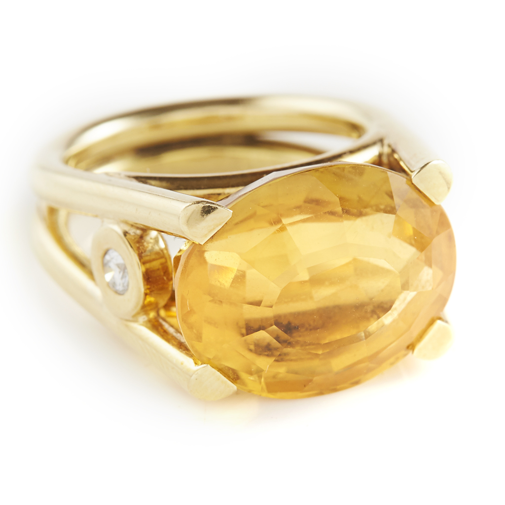 Appraisal: A citrine and diamond set cocktail ring claw set with