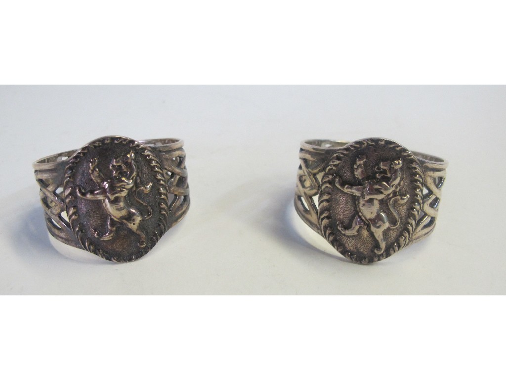 Appraisal: Pair of silver napkin rings with lion decoration in boxes