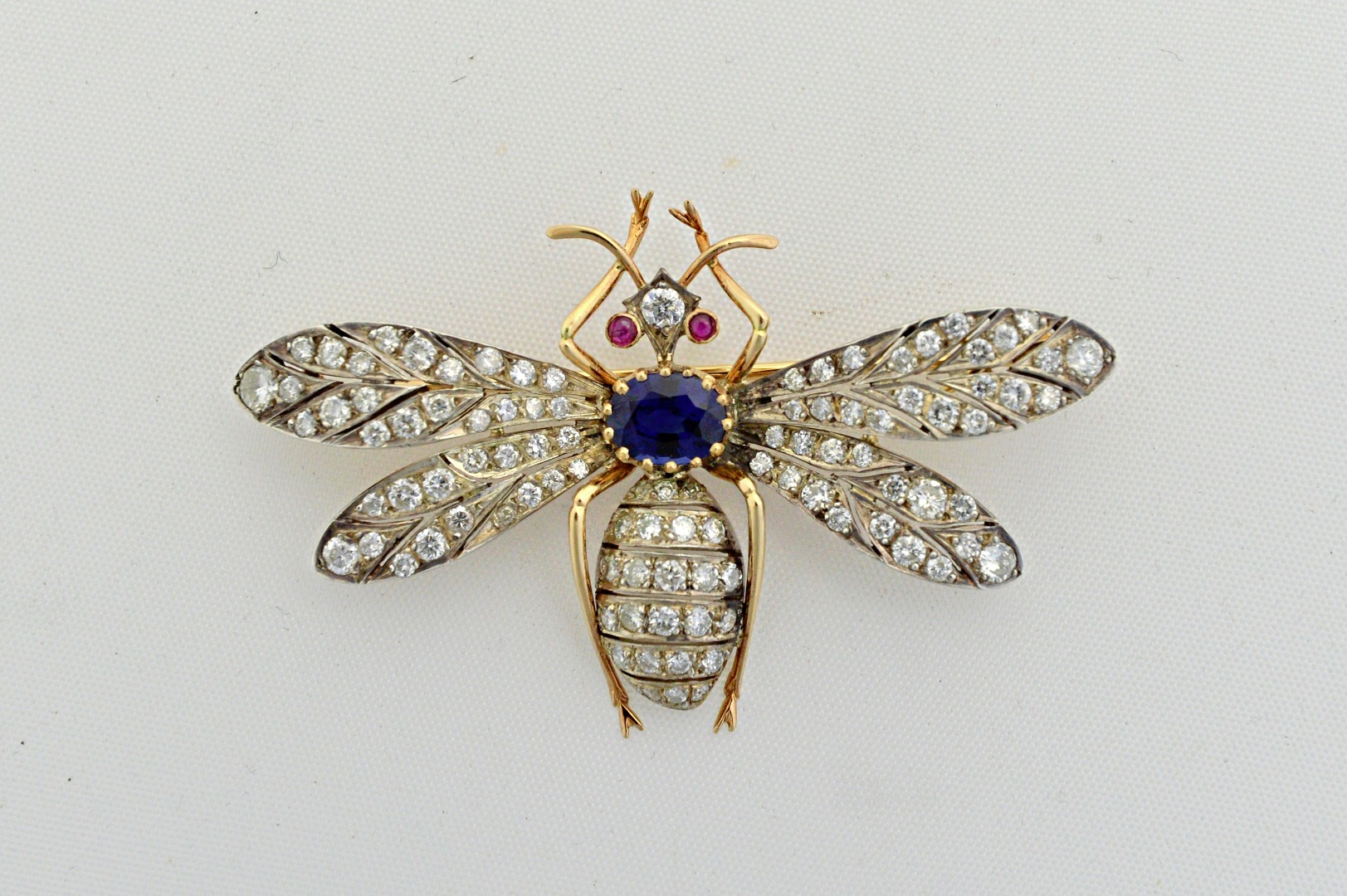 Appraisal: A sapphire diamond and ruby brooch designed as an insect