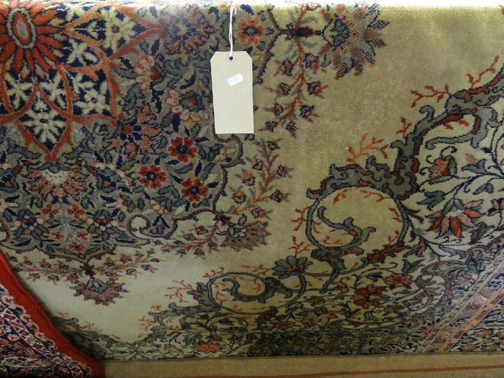 Appraisal: An Indian design carpet with a central floral medallion on