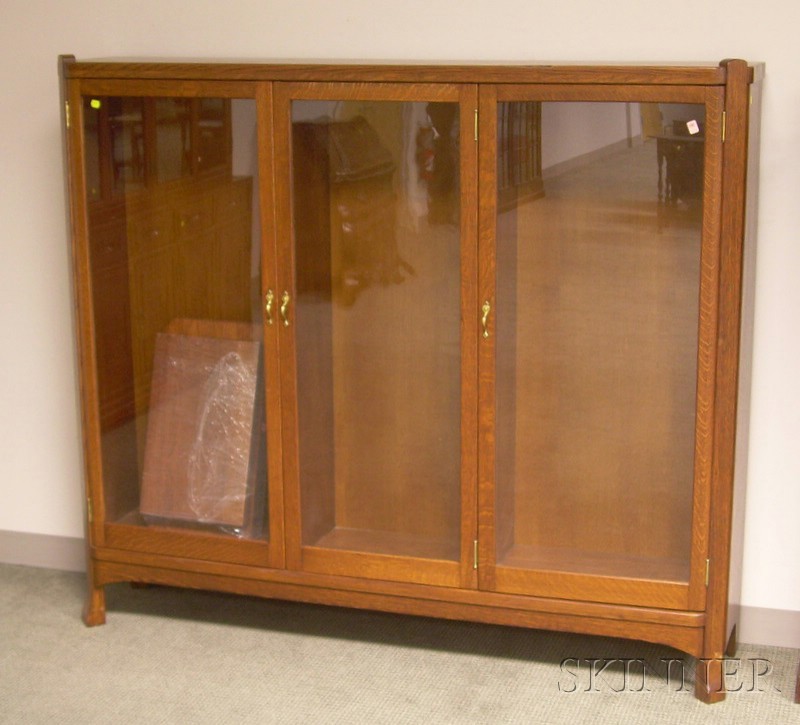 Appraisal: Arts Crafts Style Oak Three-Door Bookcase with nine adjustable shelves