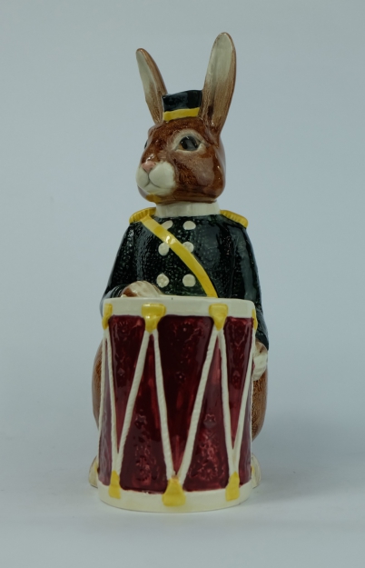 Appraisal: Royal Doulton Bunnykins moneybox as seated Bunny with drum yellow