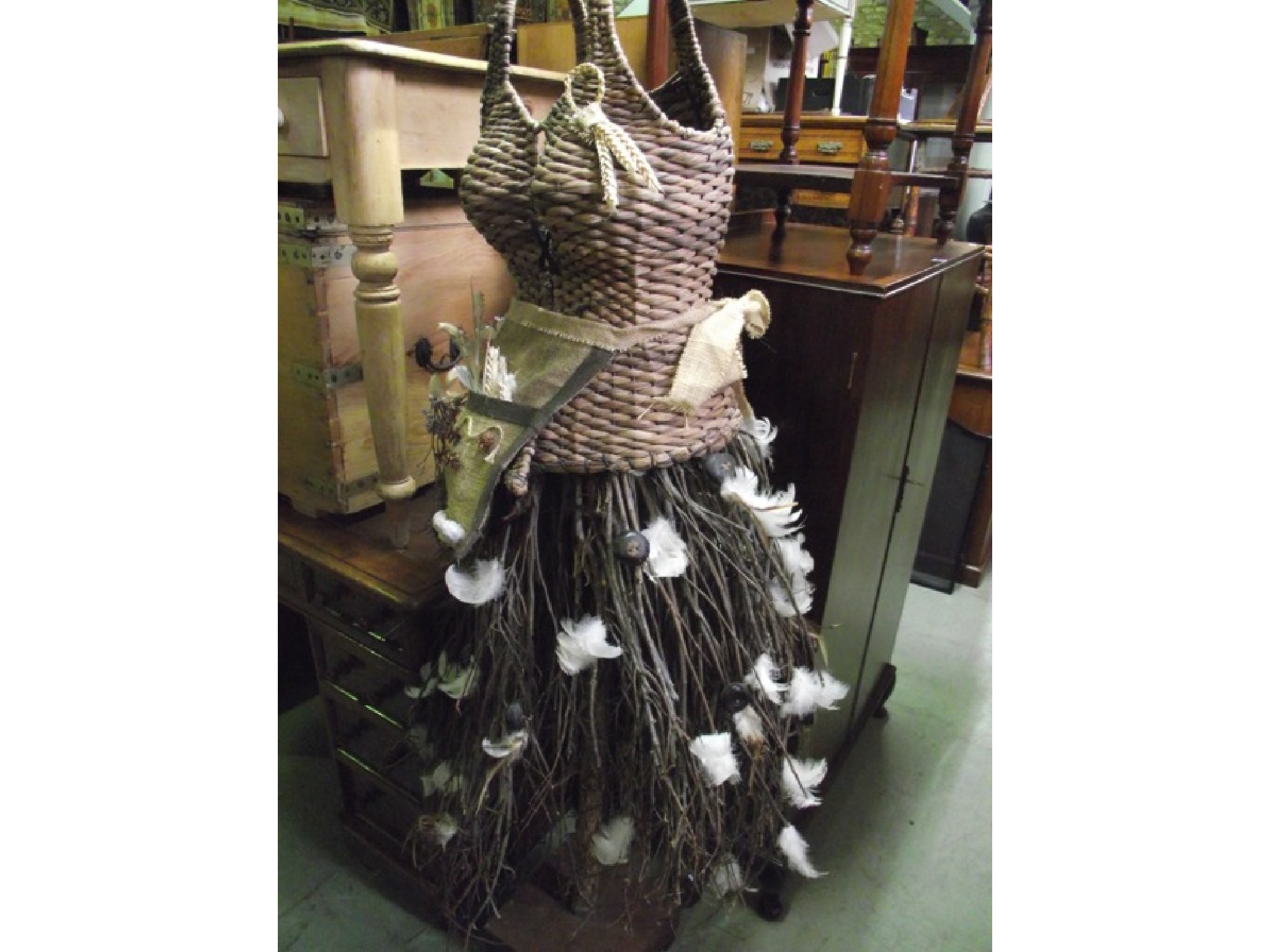 Appraisal: A contemporary folk art mannekin female torso with basket work