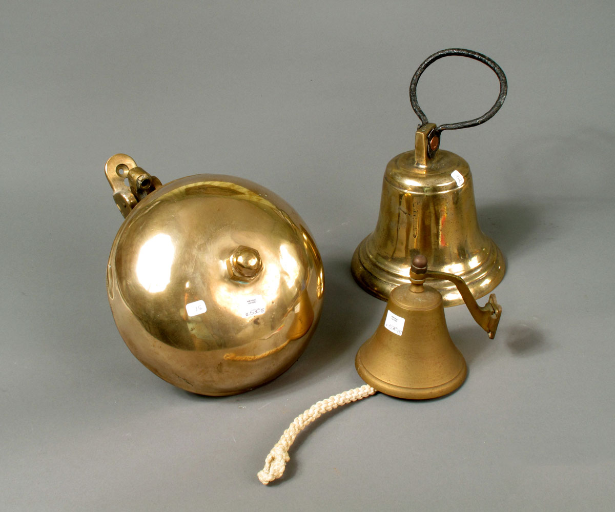 Appraisal: THREE BRASS SHIP BELLS Including two wall-mounted examples and a