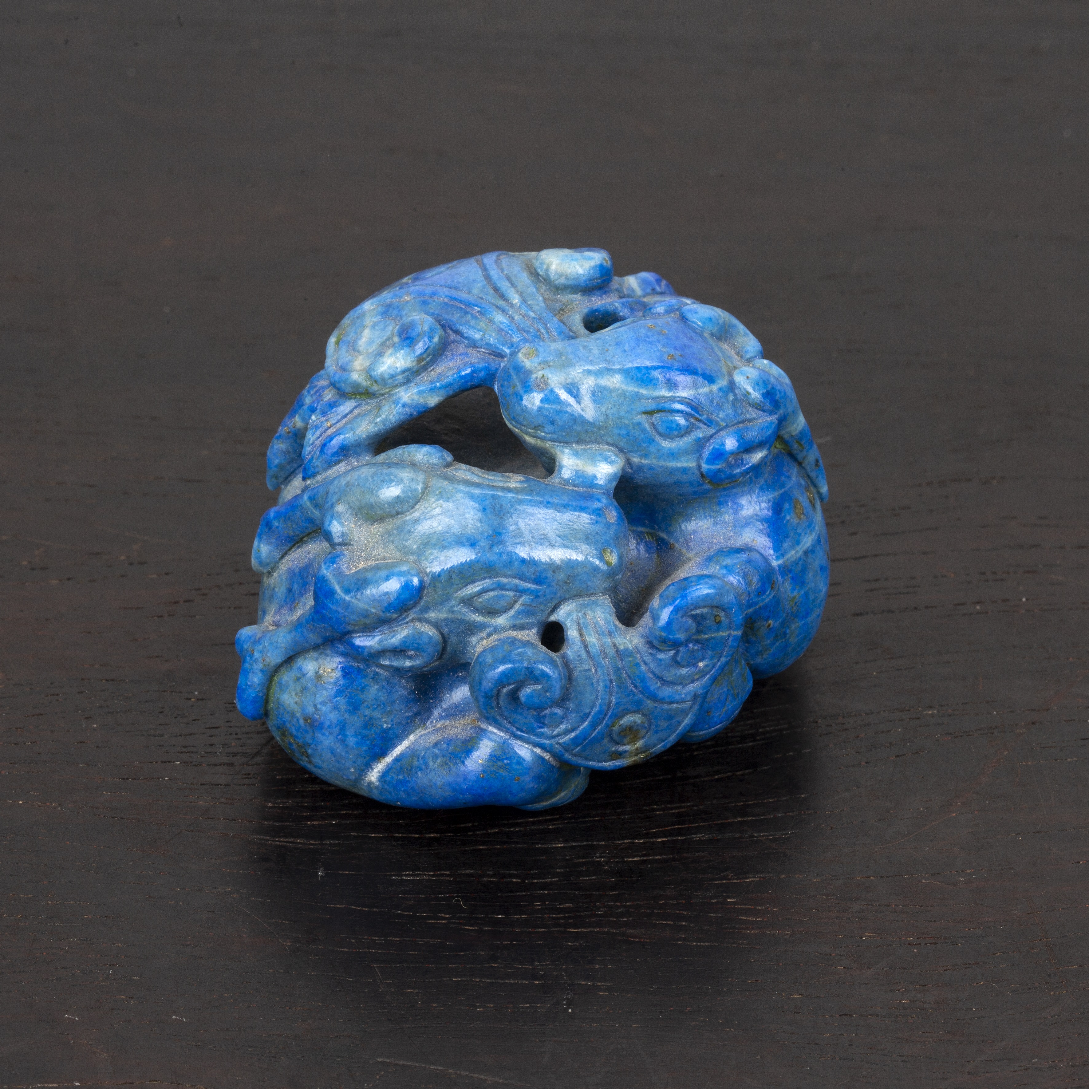 Appraisal: Lapis lazuli small carvingChinese in the form of three entwined