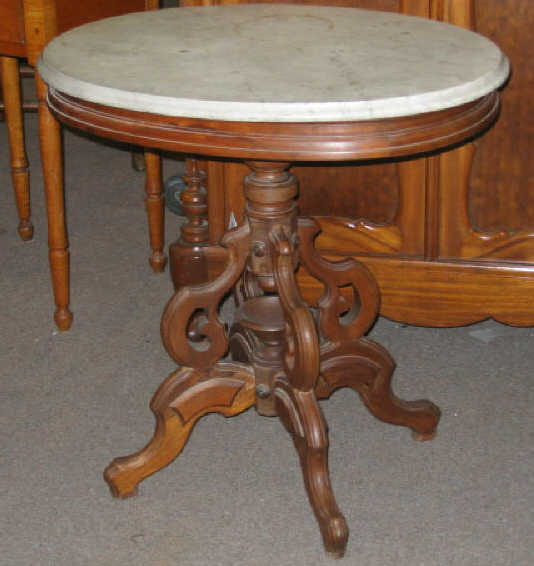 Appraisal: AMERICAN RENAISSANCE REVIVAL CENTER TABLE With an oval white marble