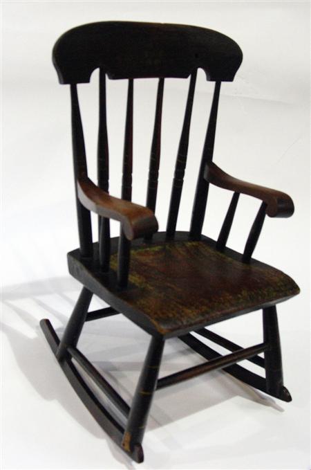 Appraisal: A late Victorian child's spindle back pine painted rocking chair