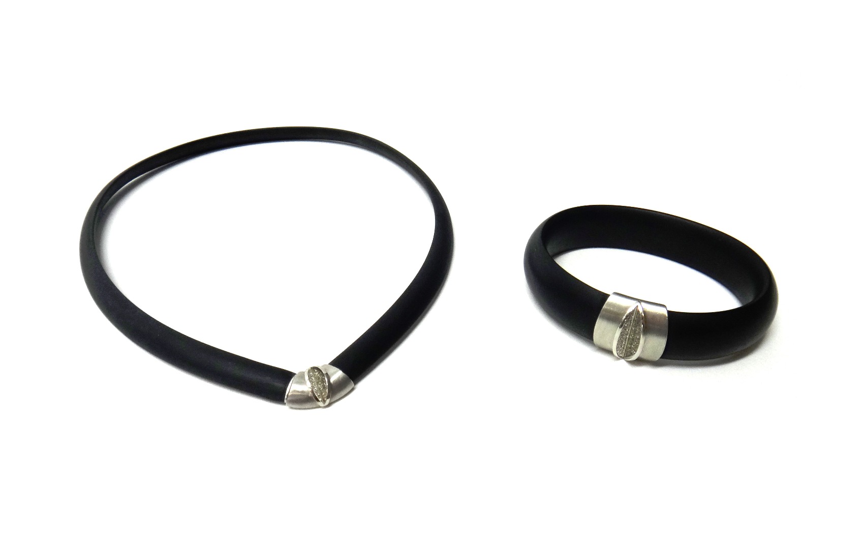 Appraisal: A platinum and diamond mounted black composition bangle and collar