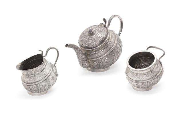 Appraisal: A late- th century 'Rosette' pattern Indian silver three-piece tea