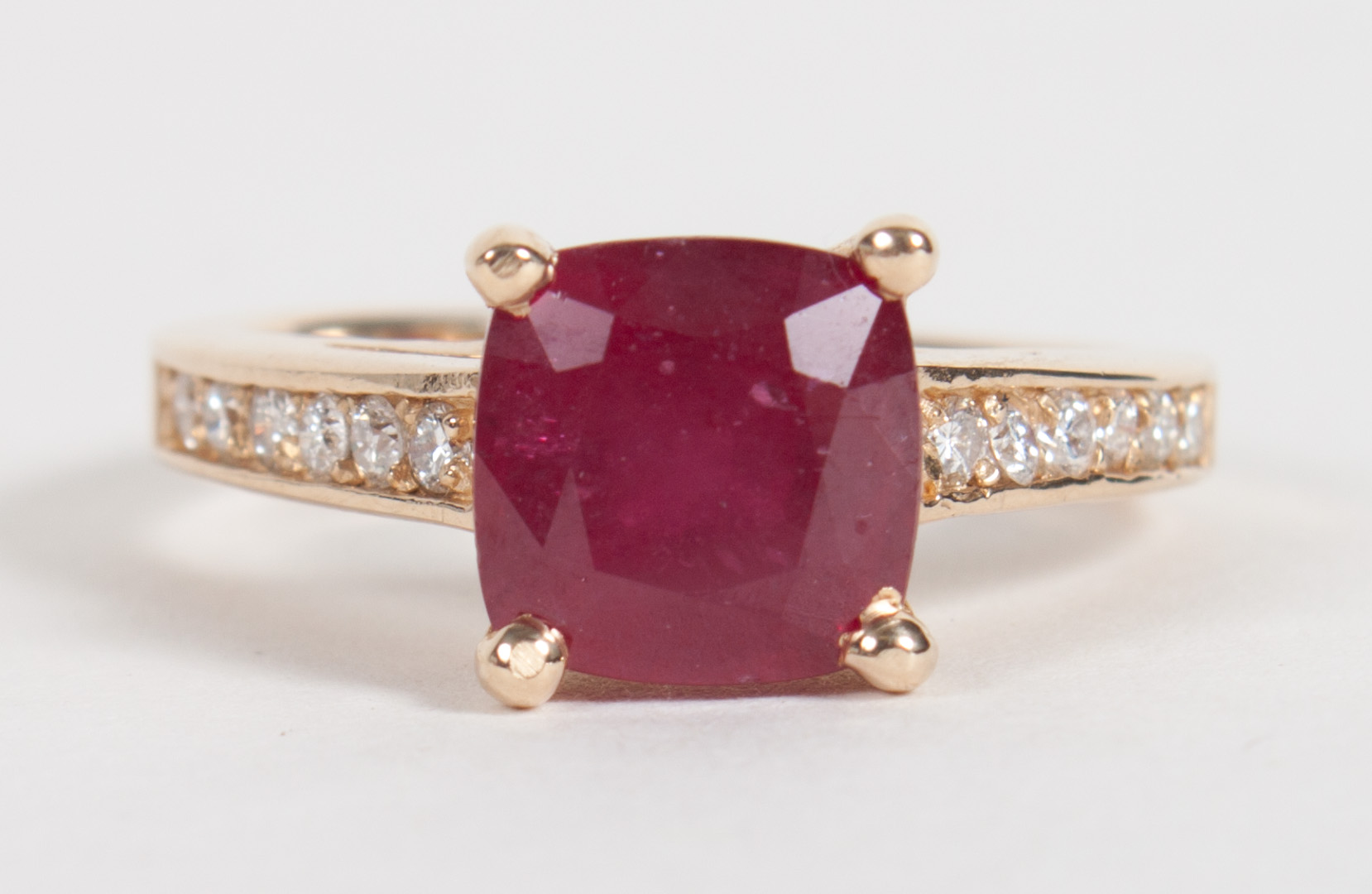 Appraisal: K gold ruby diamond ring center princess cut ruby flanked