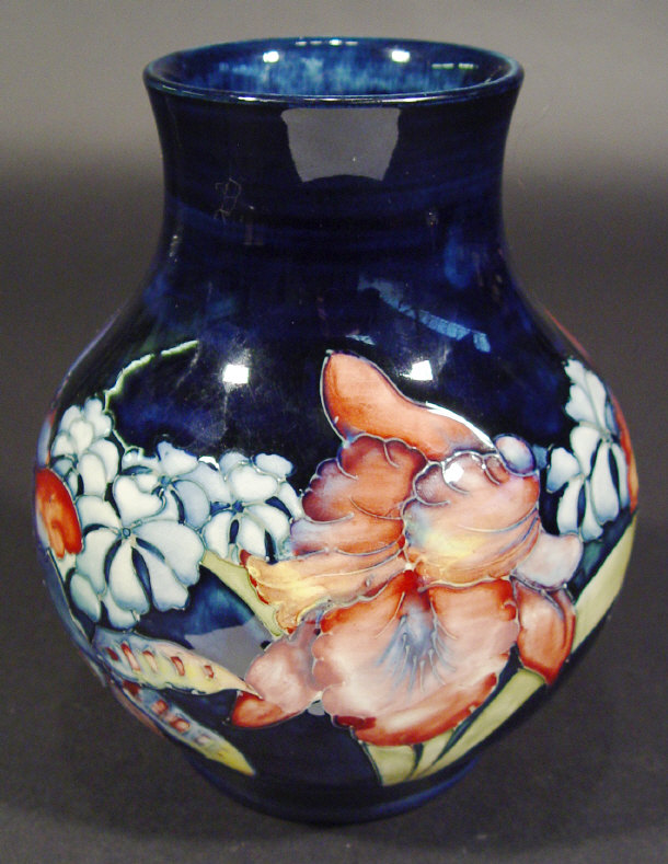 Appraisal: Moorcroft vase hand painted and tubelined with orchids onto a