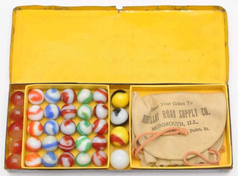 Appraisal: Akro Marble Tin Set Box set includes marbles One shooter